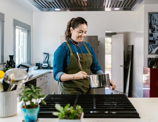 Photo by RODNAE Productions: https://www.pexels.com/photo/woman-with-apron-holding-pot-in-hand-10432852/