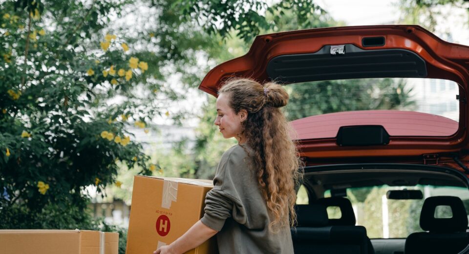 Photo by Ketut Subiyanto: https://www.pexels.com/photo/content-young-lady-unloading-carton-boxes-out-of-car-trunk-4246262/