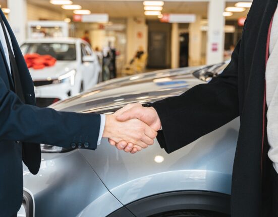 Photo by Antoni Shkraba: https://www.pexels.com/photo/close-up-of-men-shaking-hands-and-cars-in-background-7144199/